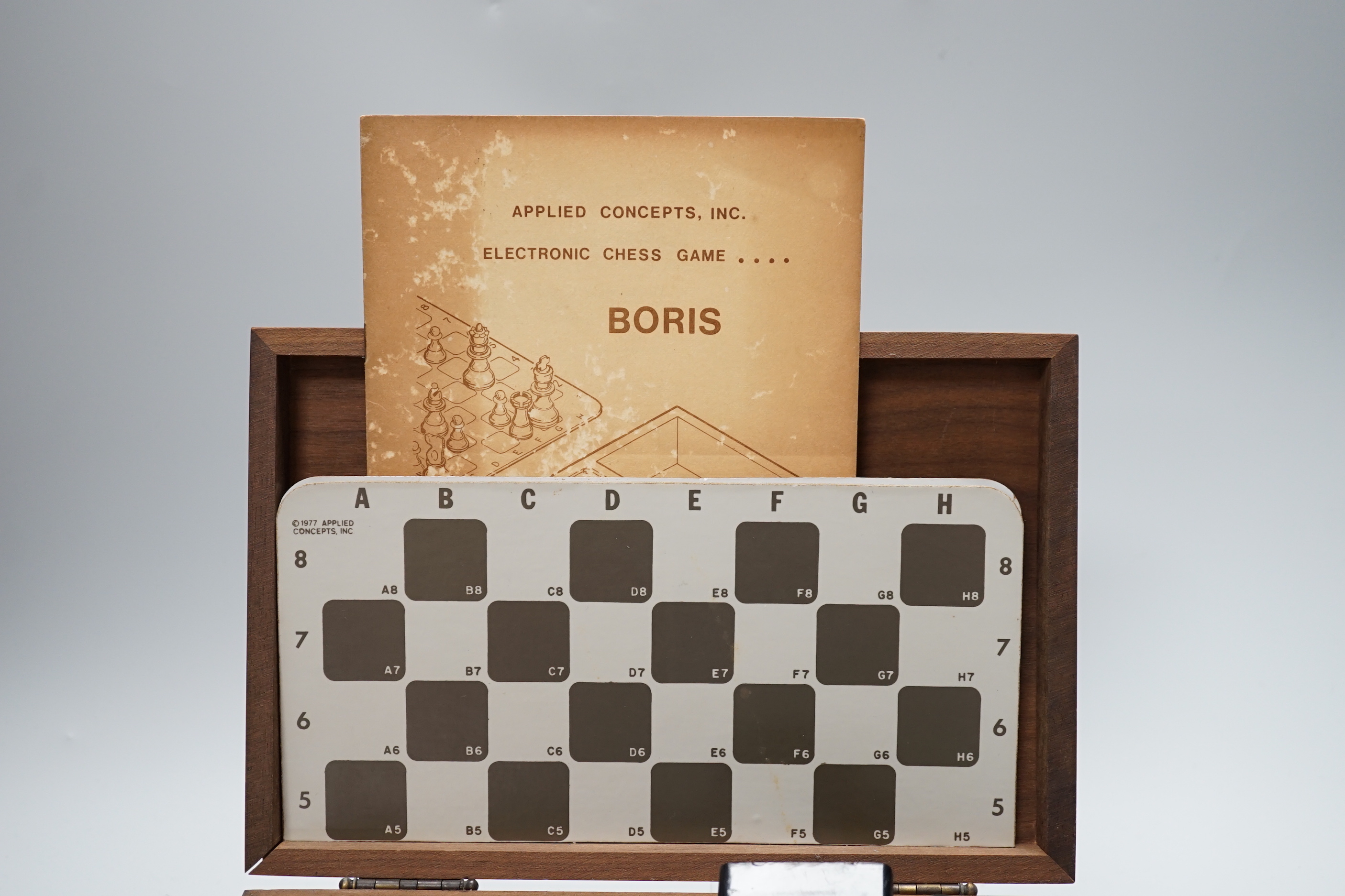 A 1970's Boris electronic chess set by Applied Concepts Inc., in a walnut case, 25.5cm x 17cm